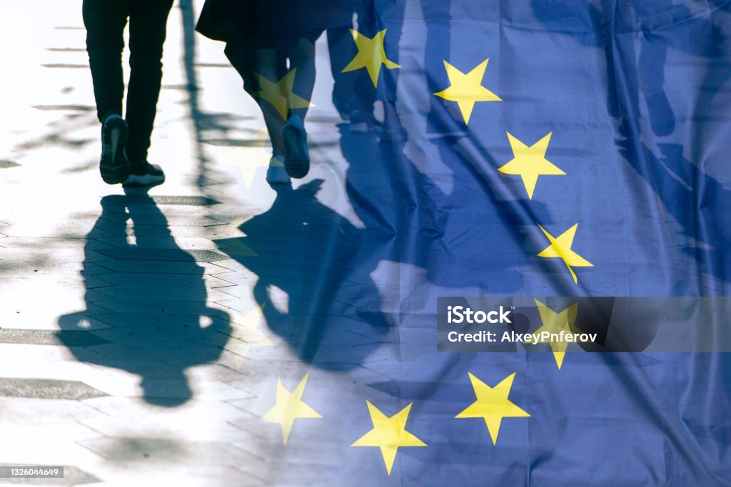 EU or European Union Flag and shadows of people, concept political picture European Union Stock Photo