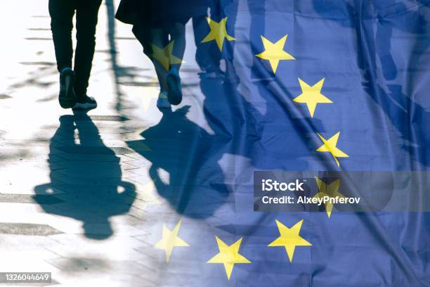 Eu Or European Union Flag And Shadows Of People Concept Political Picture Stock Photo - Download Image Now