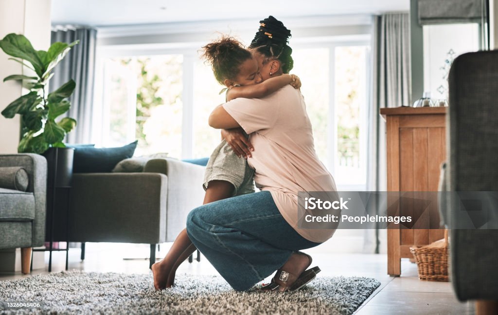 Shot of a mother and child hugging at home Hug it out Child Stock Photo
