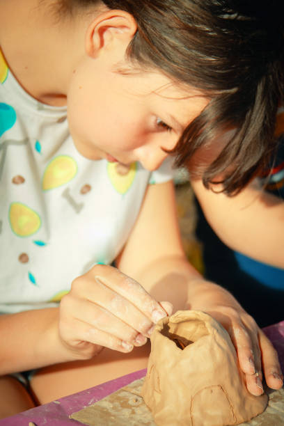istock Having fun with colorful modeling clay. Creative kids molding at home. 1326046393