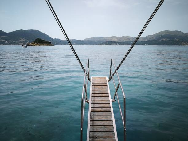 istock Yacht stairs over the blue sea 1326050142