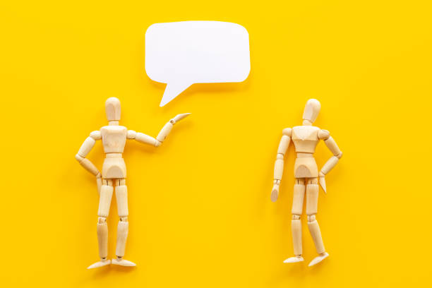 istock Wooden man figure with speech bubble banner 1326050523