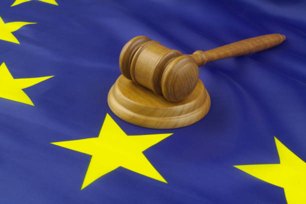 Judge gavel and shopping cart on EU flag. stock photo