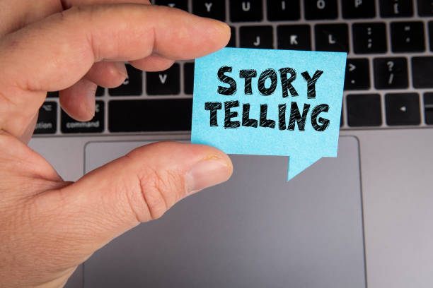 Story Telling. Speech bubble in a man's hand on a laptop background