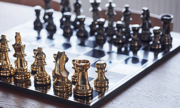 istock Chess board with metal figures on it indoors on the table at daytime 1326051791