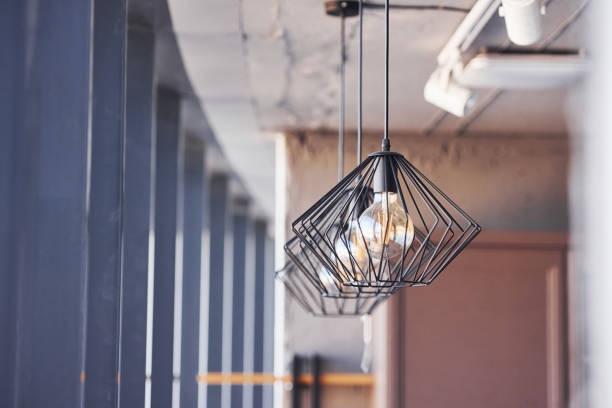 istock Interior of modern kitchen with light bulbs hanging indoors at daytime 1326052067