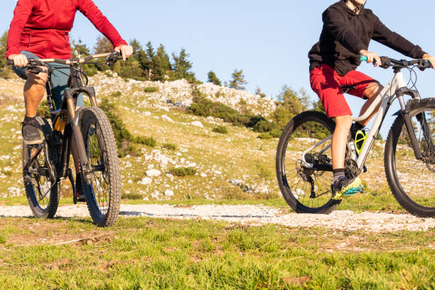 istock Mother and daughter riding mountain bikes 1326052743