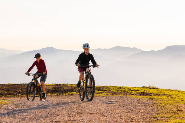 istock Mother and daughter riding mountain bikes 1326052806