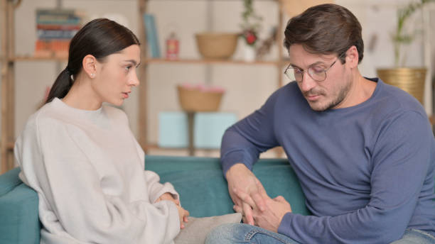 istock Tense Mixed Race Couple Sitting Upset at Home 1326053619