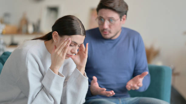 istock Man Fighting with Stressed Wife at Home 1326053647
