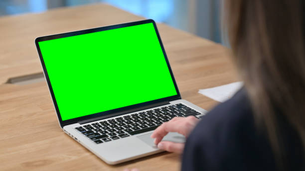 istock Businesswoman using Laptop with Green Chroma Key Screen 1326054869