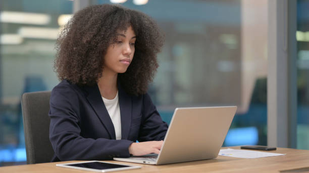 istock African Businesswoman Working on Laptop 1326054916
