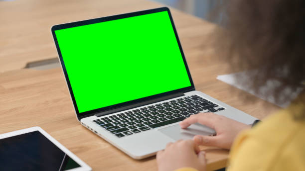 istock African Woman using Laptop with Green Chroma Key Screen 1326054920