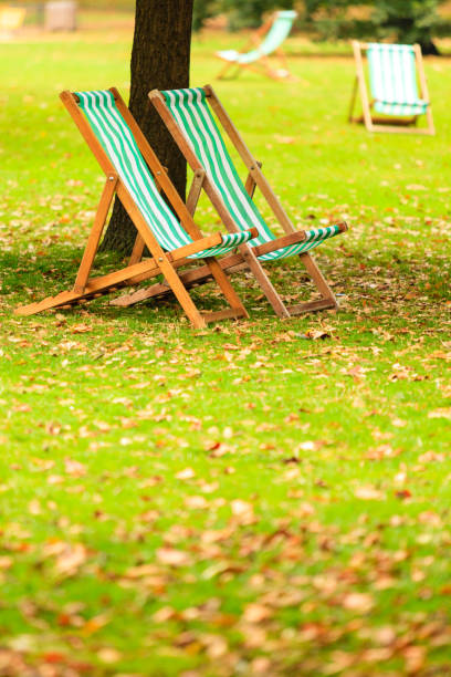 istock Empty chairs in St. James's Park London 1326057836