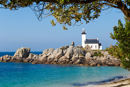 Pontusval Lighthouse on rocky shore in Kerlouan, northern Brittany, France