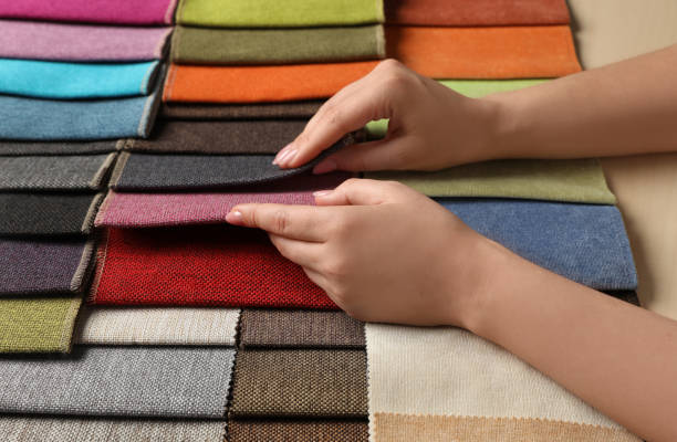 istock Woman choosing fabric among multicolored samples, closeup 1326059863