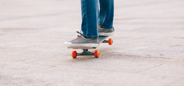istock Skateboarder legs skateboarding at outdoors 1326060154