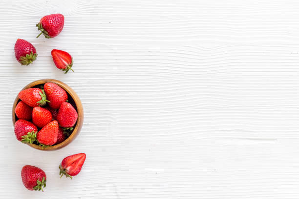 istock Fresh strawberry with leaf in bowl. Berry background. Top view 1326060558