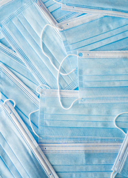 istock Medical protective masks on blue background. 1326061922