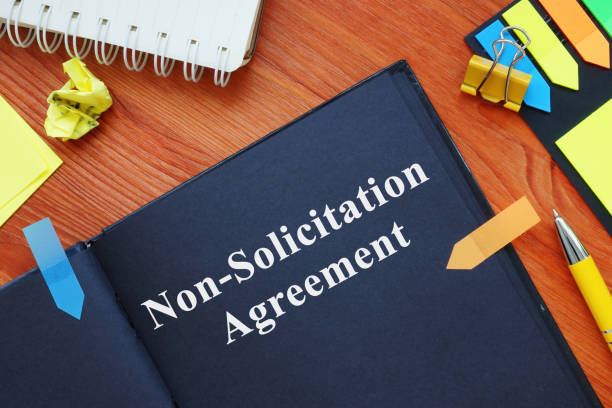 istock Non-Solicitation Agreement on black paper with pen. 1326062440