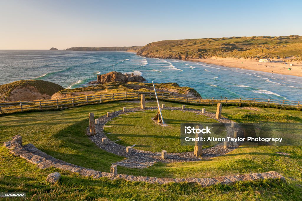 A view of Perranporth, Cornwall with the sun dial in the foreground and the beach behind A landscape view of Perranporth, Cornwall in early summer Perranporth Stock Photo