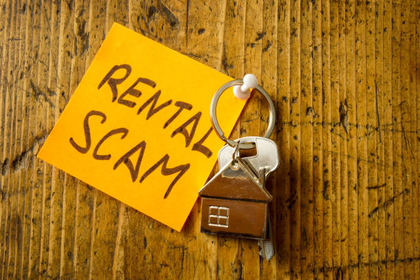 Pinned sticker rental scam and key from apartments. Pinned sticker rental scam and key from apartments. hoax stock pictures, royalty-free photos & images