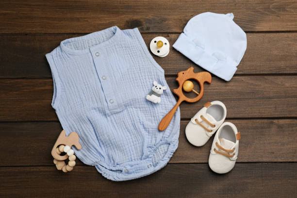 istock Flat lay composition with baby clothes and accessories on wooden table 1326063577