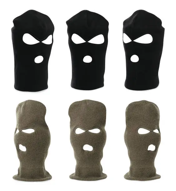 Set with different balaclavas on white background