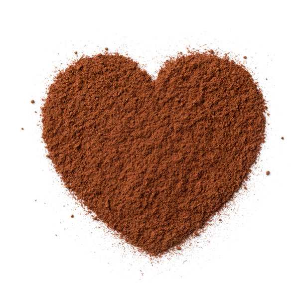 istock Brown cocoa powder in heart shape isolated on white background 1326063718