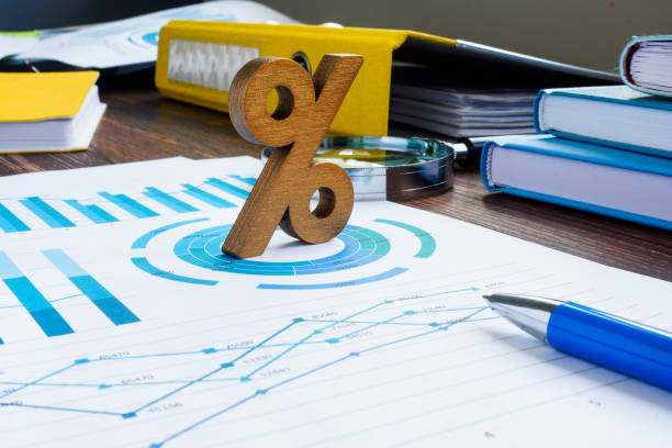 istock ROI return on investment concept. Percent sign and financial documents. 1326063740