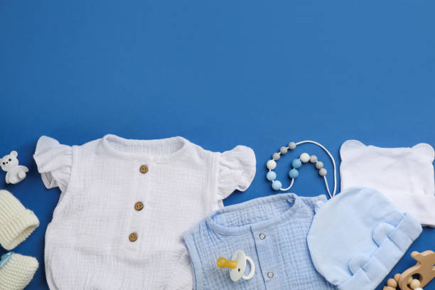 istock Flat lay composition with baby clothes and accessories on blue background, space for text 1326063929