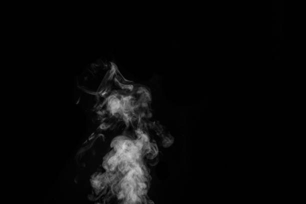 istock White smoke on black background. Figured smoke on a dark background. Abstract background, design element 1326064721