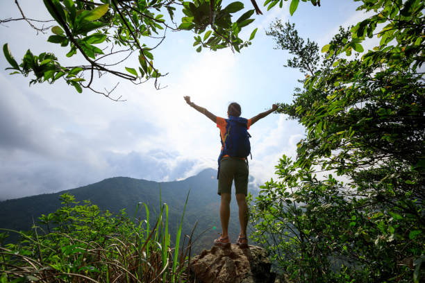 istock Successful hiker feel free at the mountain top cliff edge 1326064737