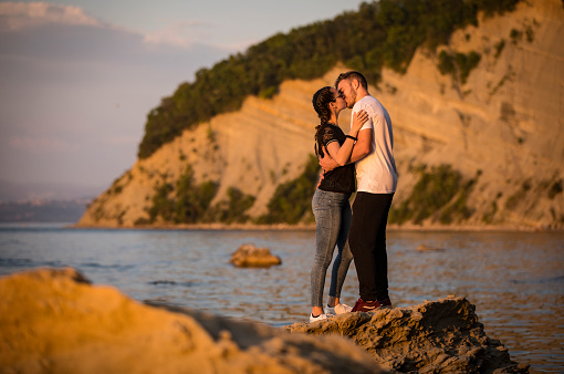Young Couple Kissing on Coastline.