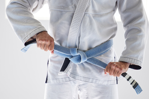 Brown belt close up on the belt martial arts backgrounds