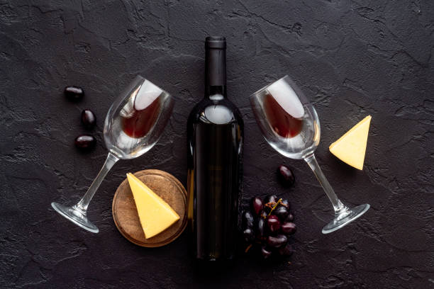 istock Red wine bottle with glasses and bunch of grape 1326069827