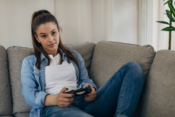 istock Woman playing video games 1326069919