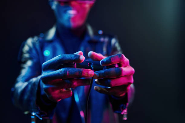 istock Virtual reality experience. Futuristic neon lighting. Young african american man in the studio 1326069946