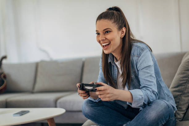 istock Woman playing video games 1326069979