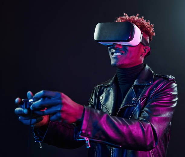 istock Virtual reality experience. Futuristic neon lighting. Young african american man in the studio 1326070093