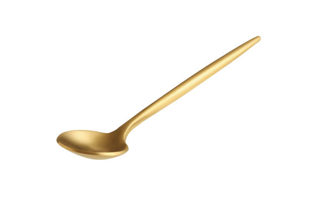 istock golden tea spoon isolated on a white background 1326070371