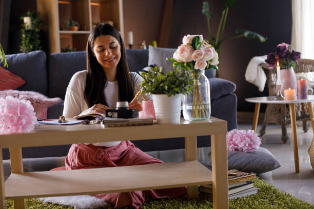 istock Copy space shot of smiling young woman writing in a diary 1326071385