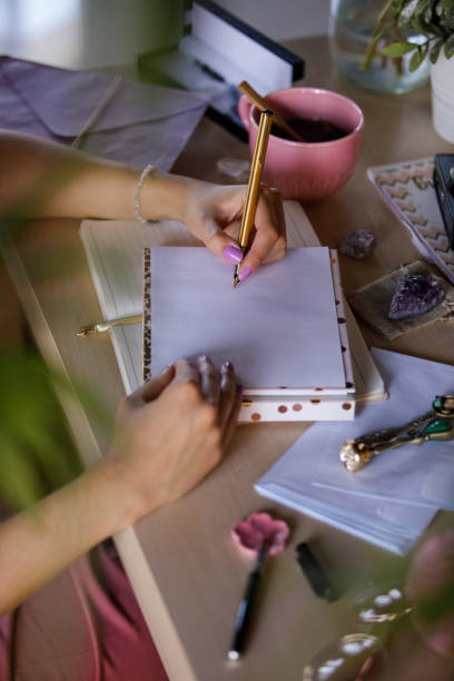 istock Unrecognizable woman writing a letter for a friend 1326071396