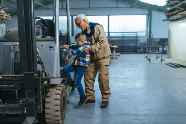 istock Grandfather and grandson having fun in warehouse 1326072861