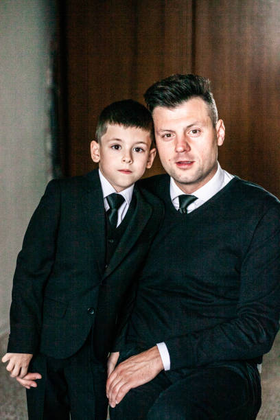 istock Portrait of father and son looking at the camera, medium shot 1326073272