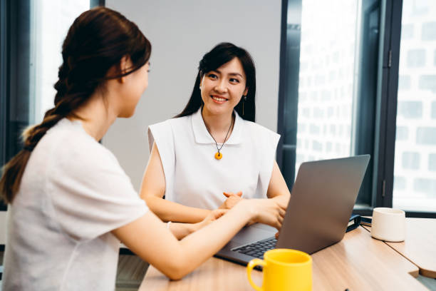 istock Two Professional Asian businesswoman working on computer in office. 1326074966