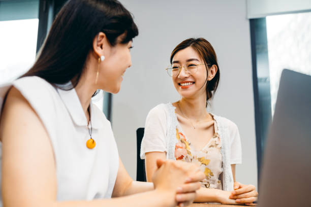 istock Two Professional Asian businesswoman working on computer in office. 1326075563