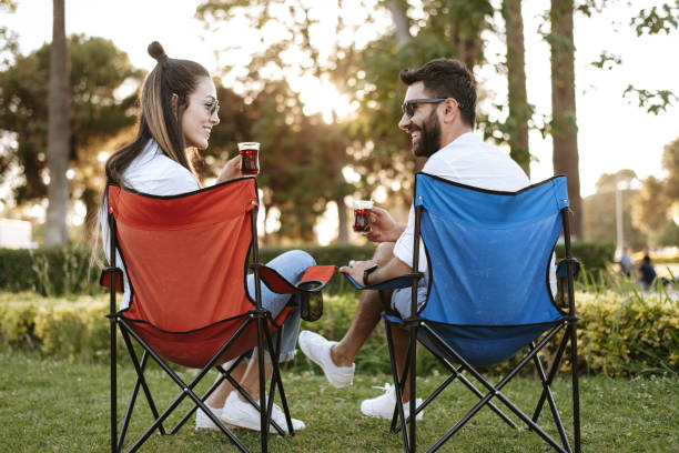 istock Young couple drinking tea at a campsite 1326081018