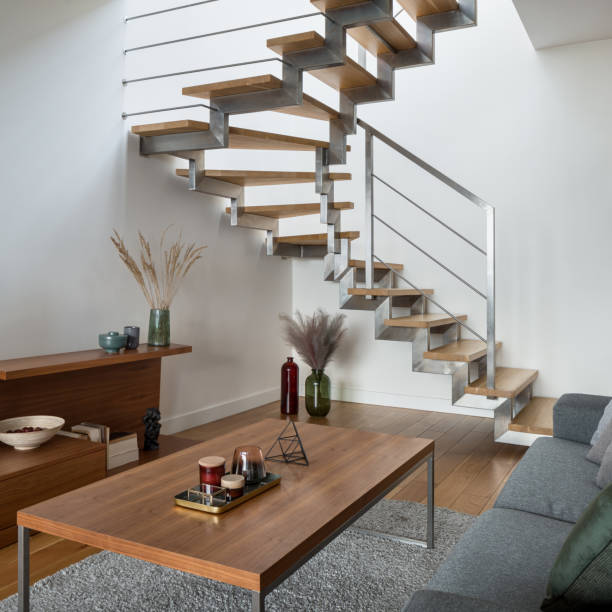 istock Modern stairs with silver elements in living room with wooden decor 1326081763