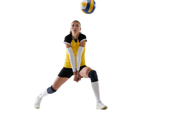 istock Female professional volleyball player with ball isolated on white studio background. The athlete, exercise, action, sport, healthy lifestyle, training, fitness concept. 1326082196